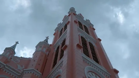 A tall tower of Neo-Gothic style Pink Church or Tan Dinh Church Ho Chi Minh City Vídeos de archivo 330863393