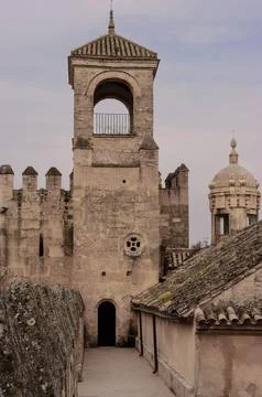 A tall tower with a small window on the top Stock Photos