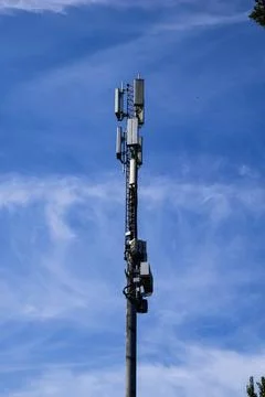 Tall tower stands against clear blue sky Stock Photos