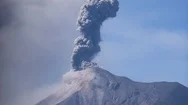 Tall Volcanic Eruption With Blue Grey Skies Fuego Volcano Guatemala 1080P Stock Footage