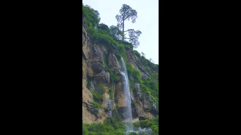 Tall Waterfall Falling from Cliff Stock Footage 316891501