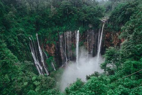 Tall waterfall in the middle of a forest on Java Island Fotos de archivo