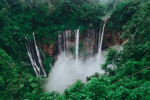 Tall waterfall in the middle of a forest on Java Island Fotos Stock