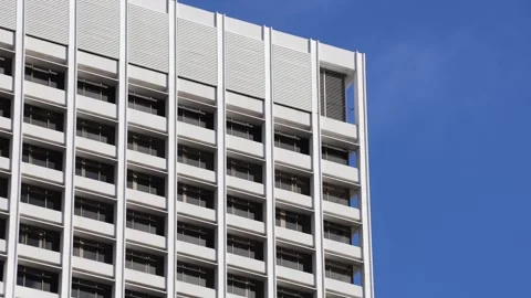 Tall White Office Building Facade Against Blue Sky Stock Footage 337679767