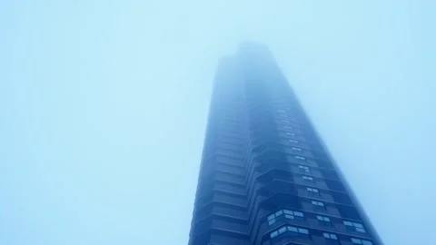 TallBuildingInFog Stock Footage 264122373