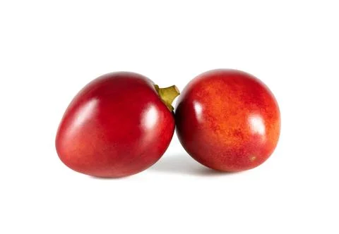 Tamarillo isolated on a white background. Two whole red fruits. Stock Photos