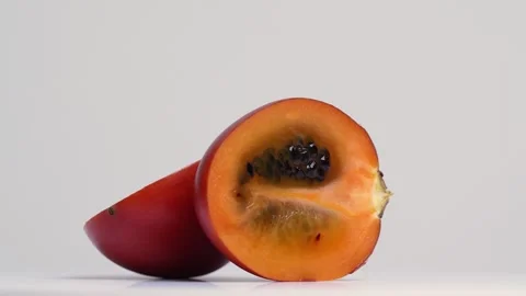 Tamarillo spinning around in a studio shot Stock Footage 249929933
