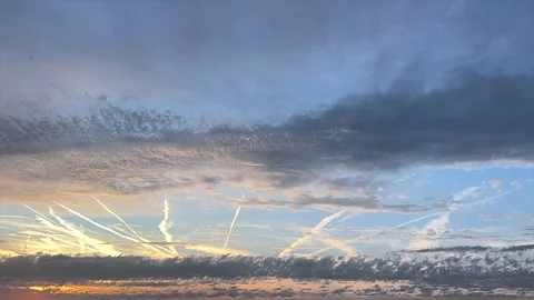 Tame Lapse of Dramatic Sunset Sky with Clouds and Airplane Contrails. Stock-Footage 346640415