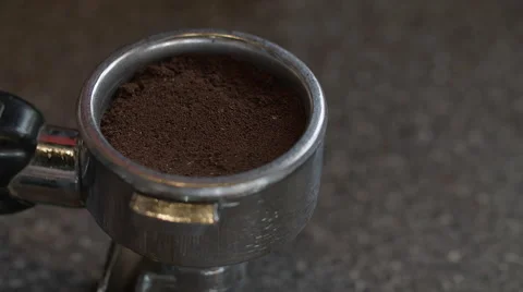 A tamper compacts coffee grounds Stock Footage 56349323