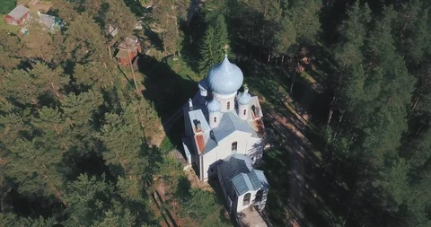 Tample in a middle of the pine forest during the golden hour Video stock 124554355