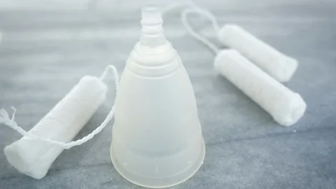 Tampons Fall in Slow Motion on a Silicone Menstrual Cup Stock Footage 102868248