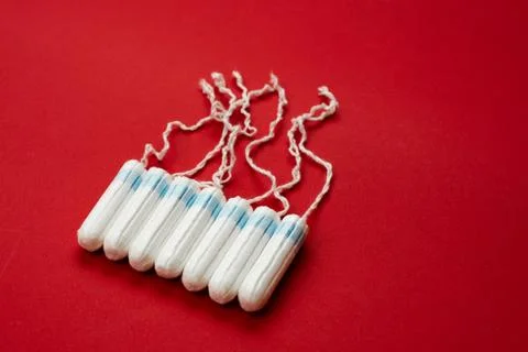 Tampons isolated on red background. Concept women sanitary protect Stock Photos