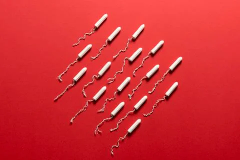 Tampons in Middle of Red aBackground Stock Photos