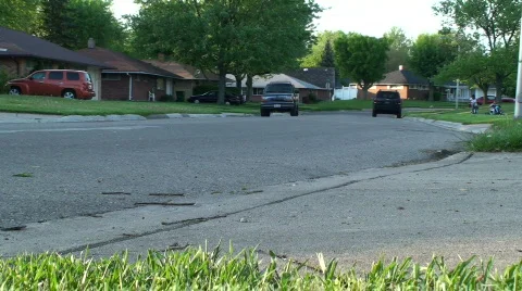 Tan car driving away from camera Video stock 702865