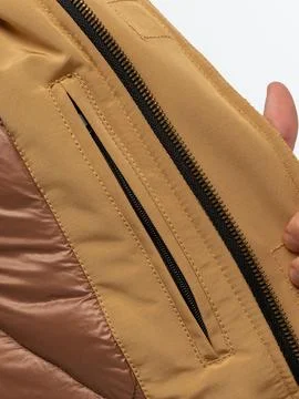 Tan jacket lining zipper pocket detail Stock Photos