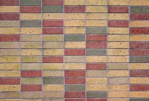 Tan red and green bricks Stock Photos