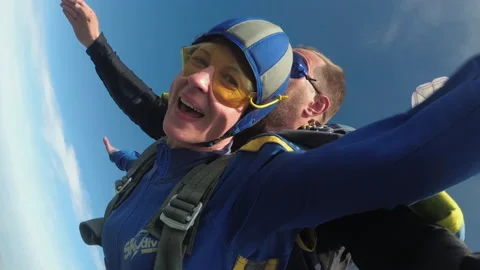 Tandem Parachute Jump with an Instructor. Skydiving. Zoom Stock Footage 155066379