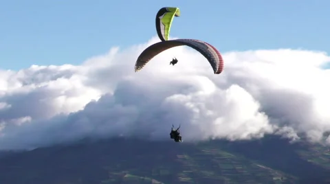 Tandem paraglide flying straight line over the rural province in ecuadorian Stock Footage