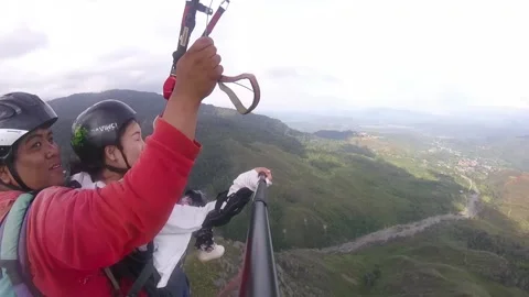 Tandem paragliding Stock Footage