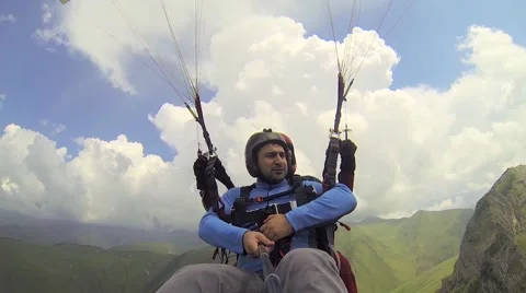 Tandem Paragliding in the Mountains Stockbeeldmateriaal 67833682