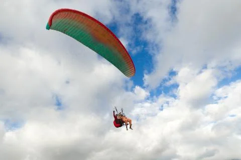 Tandem Paragliding With The Passenger In The Front And The Pilot In The Back Stock Photos