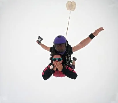 A tandem skydive into the clouds Stock Photos