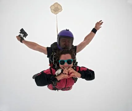 A tandem skydive into the clouds Stock Photos