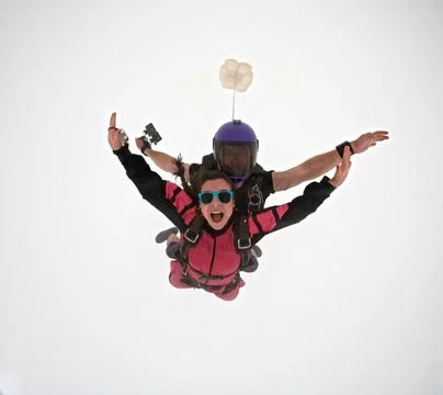 A tandem skydive into the clouds Stock Photos