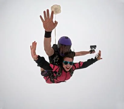 A tandem skydive into the clouds Stock Photos