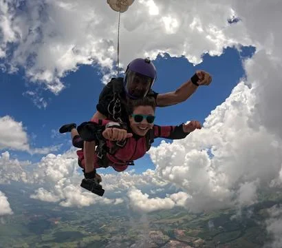 A tandem skydive into the clouds Stock Photos