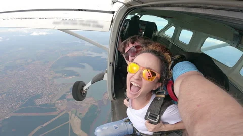 Tandem skydive over the Paraná River between Brazil and Paraguay Stock Footage 167486267