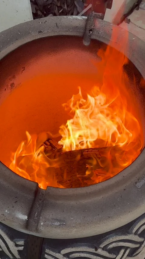 Tandoor close-up roaring fire inside clay oven (vertical) Stock Footage 319446830