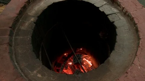 Tandoor in which the fire burns Stock Footage 70885717