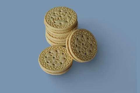 Tangerang, Indonesia-2026/07/15: Stack of biscuits isolated on blue background. Stock Photos