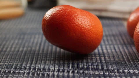 Tangerine falls on the kitchen in slow motion Stock Footage 156857356