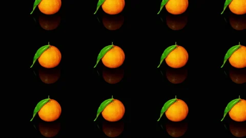 Tangerine fruit pattern on black background, 2D animation screensaver Stock Footage 166318690