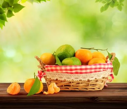 Tangerine inside basket with clipping path Stock Photos