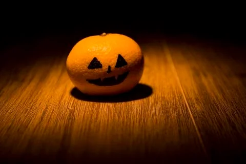 Tangerine jack o'lantern Stock Photos