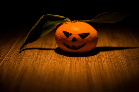 Tangerine jack o'lantern Stock Photos