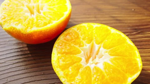 Tangerine on rotating background Stock Footage 290403262