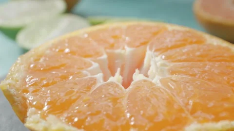 Tangerine on rotating background Stock Footage 292498689