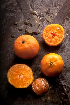 Tangerine on a rusty background Stock Photos