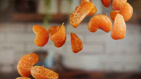 Tangerine sections in the air in slow motion Stock Footage 156845764