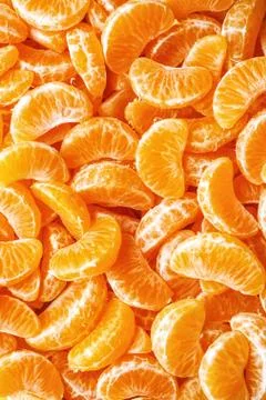 Tangerine segments, orange background texture,Flat lay, top view.healthy citr Stock Photos