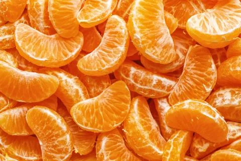 Tangerine segments, orange background texture,Flat lay, top view.healthy citr Stock Photos