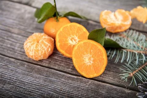 Tangerine with segments on the table Stock Photos