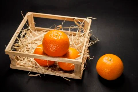 Tangerines on a black background Stock Photos