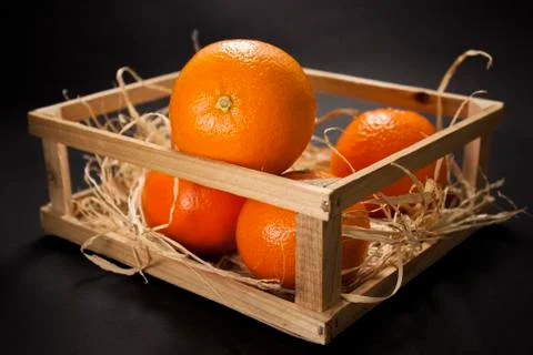 Tangerines on a black background Stock Photos
