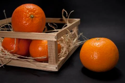 Tangerines on a black background Stock Photos