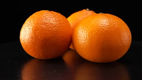 Tangerines close up on black background Vídeos de archivo 140534629